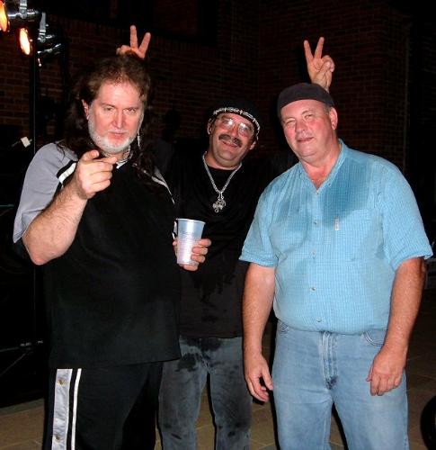 Hamming it up - The guys in the band on break, hamming it up for the camera. It was an outdoor show on a very hot and humid night as you can tell by the sweaty shirts!