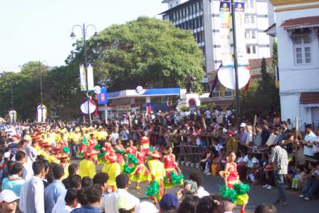 People Dancing at Carnival  - People with colorful dresses dancing for the carnival parade. 