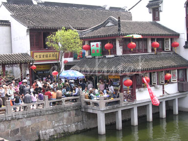 Marketplace - There're some resturants built along the river, and they are both good for delicious and scenery.  BTW, gourmet is another reason that attracts most millions of people to Qi Bao, including me. :))