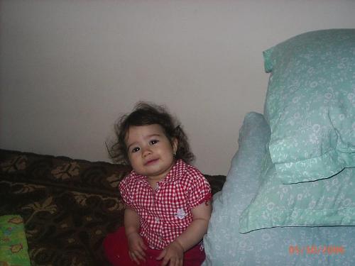 Here you can see my little granddaughter - In this picture you can see my little granddaughter,Alexia.Alexia is only one year old in this photo.She laugh all the time and when somebody laugh she is all an smile.I think that she doesn't know to cry.She is the shine of our family and this year she would have an brother,her mother would birth in June.