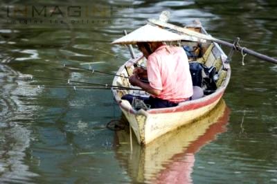 Fisherman with his fishing rod - Malaysian scenery