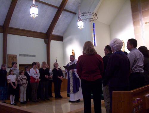 christians - a group of christians being commissioned by a priest christians - a group of christians being commissioned by a priest