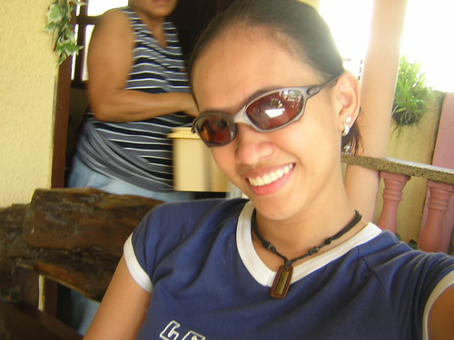 my usual get up - This is me wearing my favorite eyewear and a baby tee shirt. I usually tie my hair because if I don't, you would see how curly it is. lol