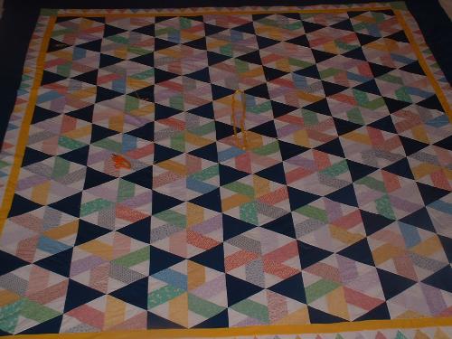 Triangle Tribulation - This quilt was made for my MIL and FIL to thank them for everything that they have done for my family. I titled it Triangle Tribulation, because it's the first quilt I made with 60 degree triangles. I don't think I'll make another one. :)