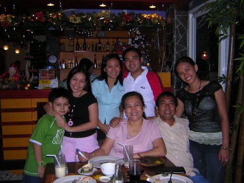 one memorable day - This is my family picture. It's only our eldest sister who is not in the picture because she's now living in Las Vegas. Her son, Sean, is with us,the one weaering a green shirt. :) My family is cool and we have a close bonding with each other :)