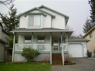My House - This is a photo of my house. We have lived here for 3 years and have decided to sell it. It was a great house.
