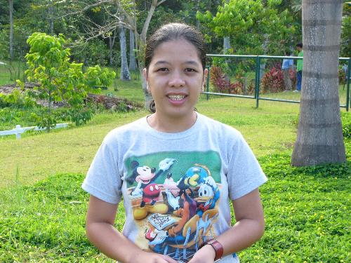 Smiling - Posing and smiling at the green background