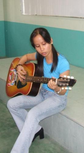 d guitar and me - this was taken during the closure program of my Call Center trainees... had to sing and play the guitar for them...