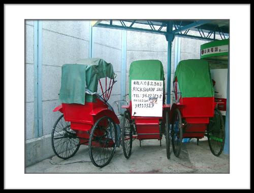 Rickshaws - Amidst the modern skyscrapers, old customs like riding rickshaws are still in hong kong