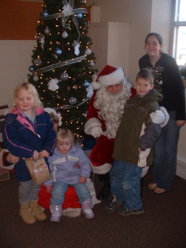 a Trip to Santa - This was taken Christmas 2006. We took our kids and neighbor's niece to see Santa. They had a great time.