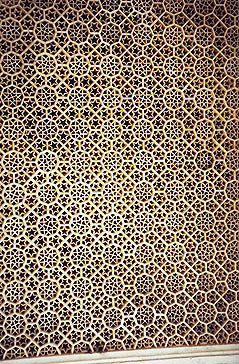 marble - This carved marble lattice screen forms one of the walls on the tomb of Shaikh Salim Chishti at Fatephur Sikri. The screen is carved from a single piece of marble.
