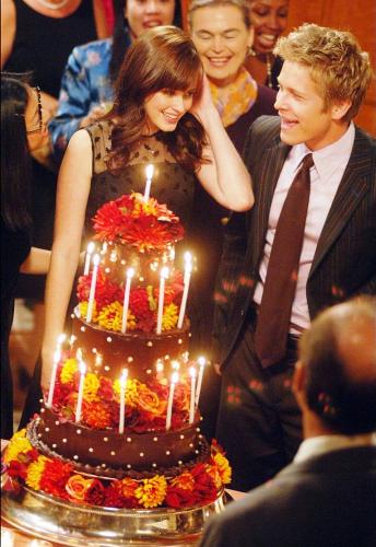 Rori With Cake From Logan - This is one of the prettiest pictures I have of Gilmore Girls. The cake is so beautiful, Logan is such a sweetheart to her.