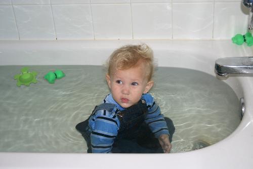 Bathing - My son in the bathtub fully dressed