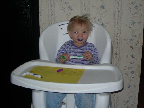 i like cake - age one eating birthday cake.