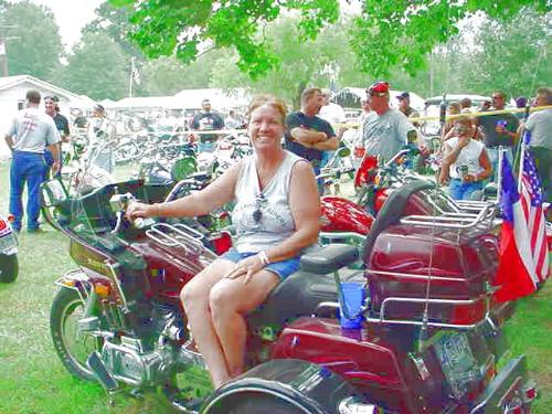 My trike - Me (Tammy)on my trike..It's a Honda Goldwing 1200 with a trike kit..Won 1st place in show at the Davy Crockett Riders Rally..It was ungodly hot that day..And no I dont ride like I'm dressed in the pic..I leather up to be safe..