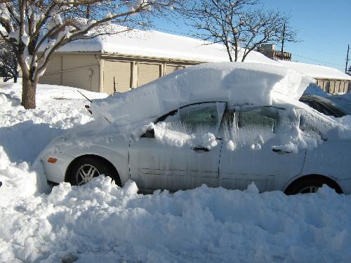 My girlfriend's car after the December blizzard - Steph's Ford Focus buried under more then two feet of snow!