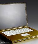 Laptop  - Accentric solid gold laptop 20.26ram5 g.20 lcd mousepad keyboard made of authentic elepahnt ivory Diamonds all around laptop..