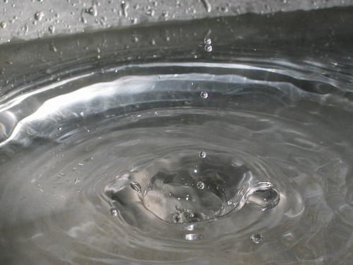 Water drops, macro shooting - This picture is shoot very close to water surface when water drops are dropping into. You can actually see a huge crater in water.