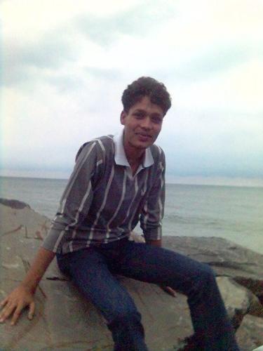 My friend at beach - see the astounding view of marina beach of chennai, india, behind my friend.