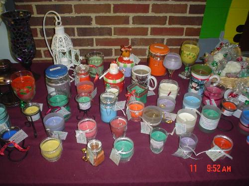 Variety of Soy candles - This is a picture of when I first started out making soy candles. I make a variety of different containers, tealights, votives, tarts and melts. Many colors and scents to choose from. I am now going to jar candles and open top containers along with keeping tealights, votives, tarts and melts. I am just now trying to experiment with pillars but have found that most people prefer container candles.