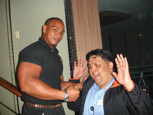 Bouncer's bicep bigger than my head - This was a picture taken in a trade/media launch of our company. We decided to have this picture taken with one of the nastiest bouncers I have ever seen in my life.