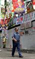 a day at the park - a policeman amidst a flora of campaign posters