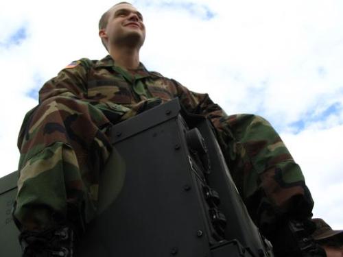 Army Soldier - Tim sitting on a generator.