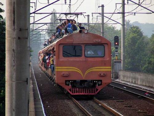 Miracle Ride - People travelling on the roof top of the electrical train.