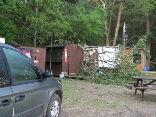 August tornado - When we arrived at the trailer on Aug. 3/06, this was the scene. There had been a tornado touch down Aug. 2/06, the day after we left to bring the dog home after he died. There were many trees down, smashing the sheds and causing serious damage to the trailer. Fortunately, although some of our friends had worse damage, nobody was hurt. We were very glad that we weren't there during it as we heard it was fierce and we probably would have died of fear!