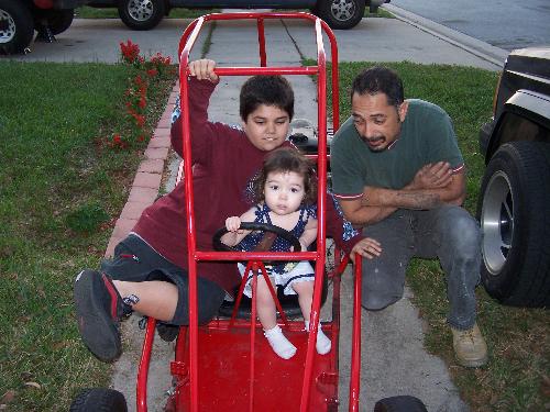 had kids - Dad, Jim and Julie haning out in the go cart.