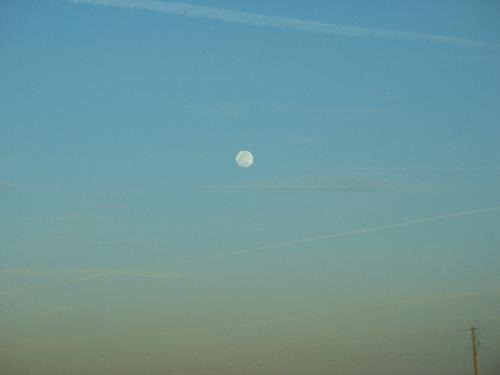 Moon on the way to Houston - At a little past 6pm, we could see the sunset as well as the moon rise.