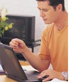 man on his computer - man using his computer