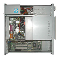 The inside of a Computer - A basic desktop pc that is opened with internal parts exposed.