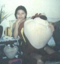 taz and me... - see? i told you taz is my fave...this was taken years ago when i was still single...my husband (who was then my boyfriend at that time) gave me these 2 stuffed taz toys, one big and one small...he even gave one taz knapsack, one taz pouch, one taz pen, a dozen taz shirts, etc...aint he sweet? i meant taz...