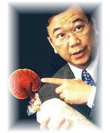 DXN Lingzhi or Red Mushroom - DXN CEO Dato Dr. Lim Siow Jin holding a healthy DXN Ganoderma or Red Mushroom, called "The King Of Herbs" by the ancient Chinese because of its potency and anti-aging properties.