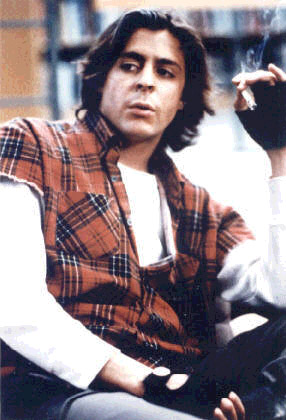 As John Bender - One of the nine original members of the 1980s 'brat pack', along with Andrew McCarthy, Mare Winningham, Anthony Michael Hall, Demi Moore, Rob Lowe, Molly Ringwald, Emilio Estevez and Ally Sheedy. Judd Nelson starred in such movies, 'Making the Grade', 'Fandango', 'The Breakfast Club' and 'St. Elmo's Fire'. With his privileged upbringing, Judd could have brought the right degree of preppy-smarmyness to any number of vapid roles, but his intense stare and dark smoldering looks gave him a hint of danger which added to his credibility in films like the Billionaire Boys Club, From the Hip and New Jack City. He later stared in the tv show 'Suddenly Susan.'