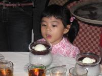 My Precious - My Baby at family dinner... Desert came and the curious little face