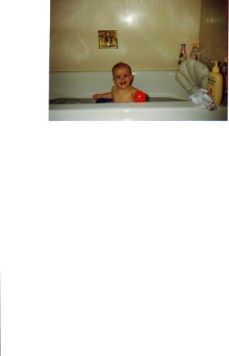 My son in the tub - He wasn't left alone at this age. :) But between 4 and 5 for a few minutes at a time until he proved that he could follow the rules.