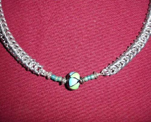 Bright Aluminum rings with blue mosaic bead - Here I used 20 gauge 3/16' bright aluminum. Using aluminum makes this piece very lightweight. This is my favorite piece.