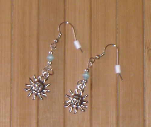 Sun charm earrings - Sun charm earrings with a blue bead. I made these for my little sister for Christmas and sell them in my etsy shop.