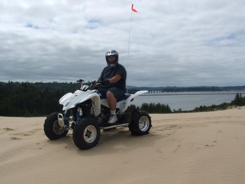 My honey at the Dunes - This is my husnabd at Oregon Dunes. What a great summer vacation we had... He is sitting onhis Suzuki Z400