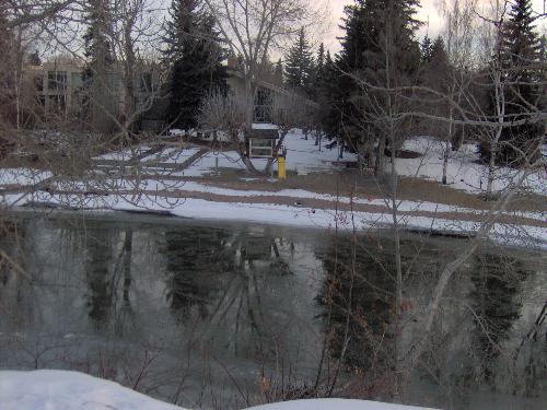 A tree house with real windows.... - Wow! what kid wouldn't want to go out and play in this back yard.  At tree house with real windows overlooking the river.   I wonder how many fond memories will be born here?