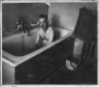 man in bathtub - taking a bath