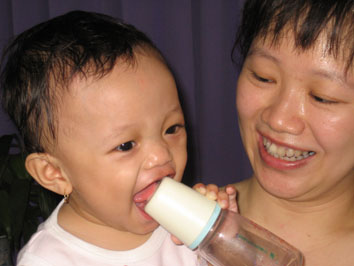 I love my bottle - This was taken on the night of New Year's Eve 2007.
She was playing with her bottle and now she can open it by herself. What a strong hands. I love my bottle - This was taken on the night of New Year's Eve 2007.
She was playing with her bottle and now she can open it by herself. What a strong hands.