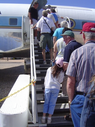 boarding the plane, a long line of passengers wait - boarding the plane, a long line of passengers wait to get on the plane boarding the plane, a long line of passengers wait - boarding the plane, a long line of passengers wait to get on the plane