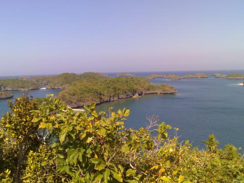 hundred islands - hundred islands is located in pangasinan, philippines.  you can rent a boat and tour the islands :)