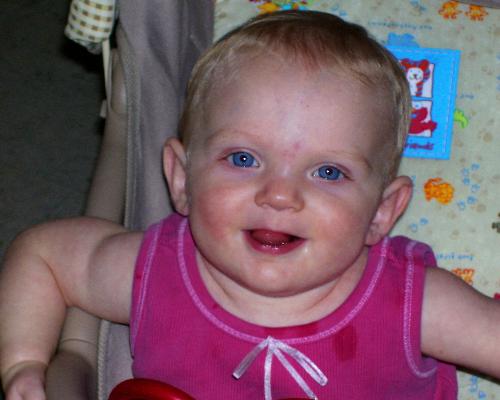 carlena in her chair - This is a picture of my daughter in her stroller . We are on our way for a walk!