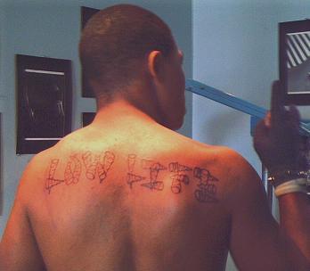 My Nephew's Loyalty - it was his first tattoo....matter of fact that bum owes me money!