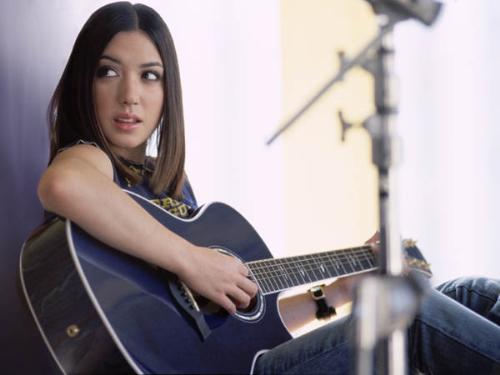 Michelle Branch playing her Guitar - Michelle Branch was born on 2nd July 1983, She is an American singer songwriter, and guitarist.  She received a guitar from her parents for her 14th birthday and, three years later had signed a deal with maverick records and had four top ten hits.