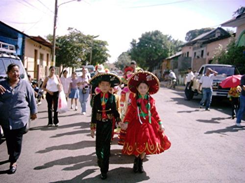 Marimba Dancers  - These are called Marimba dancers.  They are walking from a house in one neighborhood to another to dance a typical dance for this area in Masaya, Nicaragua. The music is played on a Marimba, which is similar to a xylophone. The marimbas are made in this area.